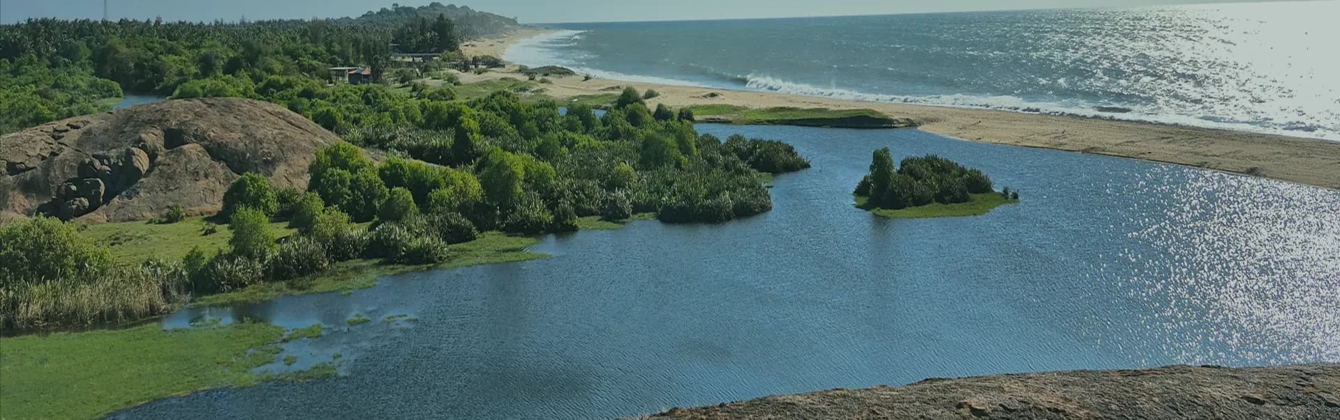 Aerial view of Arugam Bay's coastline and lagoon